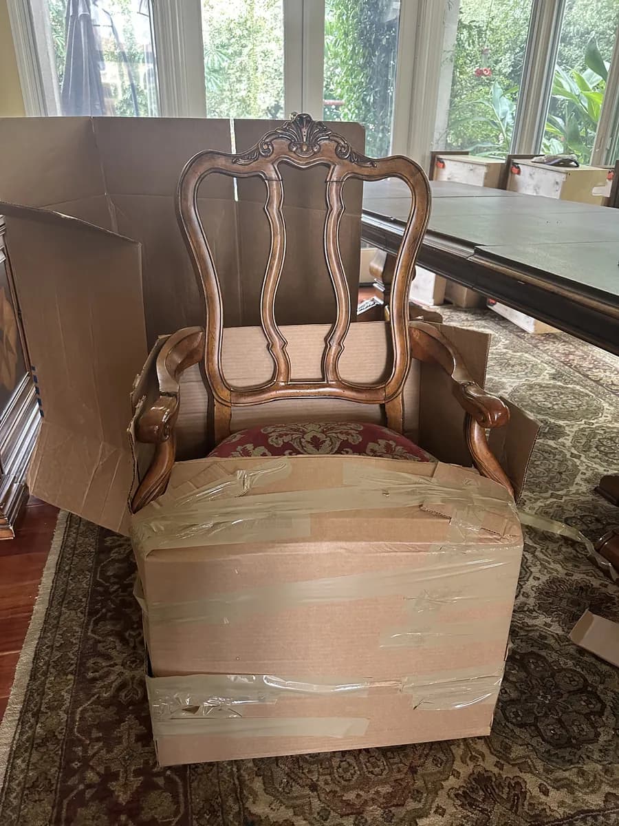 Antique armchair custom-packed in a tailored carton during an art and antique pack-out
